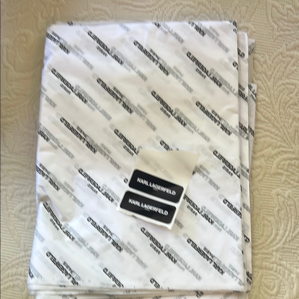 Karl Lagerfeld White and black logo tissue paper. With two stickers.